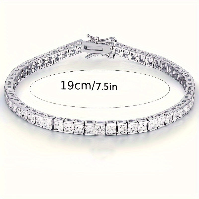 Elegant hand jewelry decor featuring a square, shiny zirconia tennis bracelet.