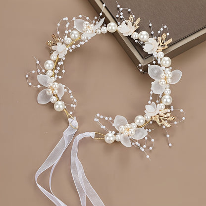 Elegant white plastic headband with floral design for girls, perfect for performances and vacations.