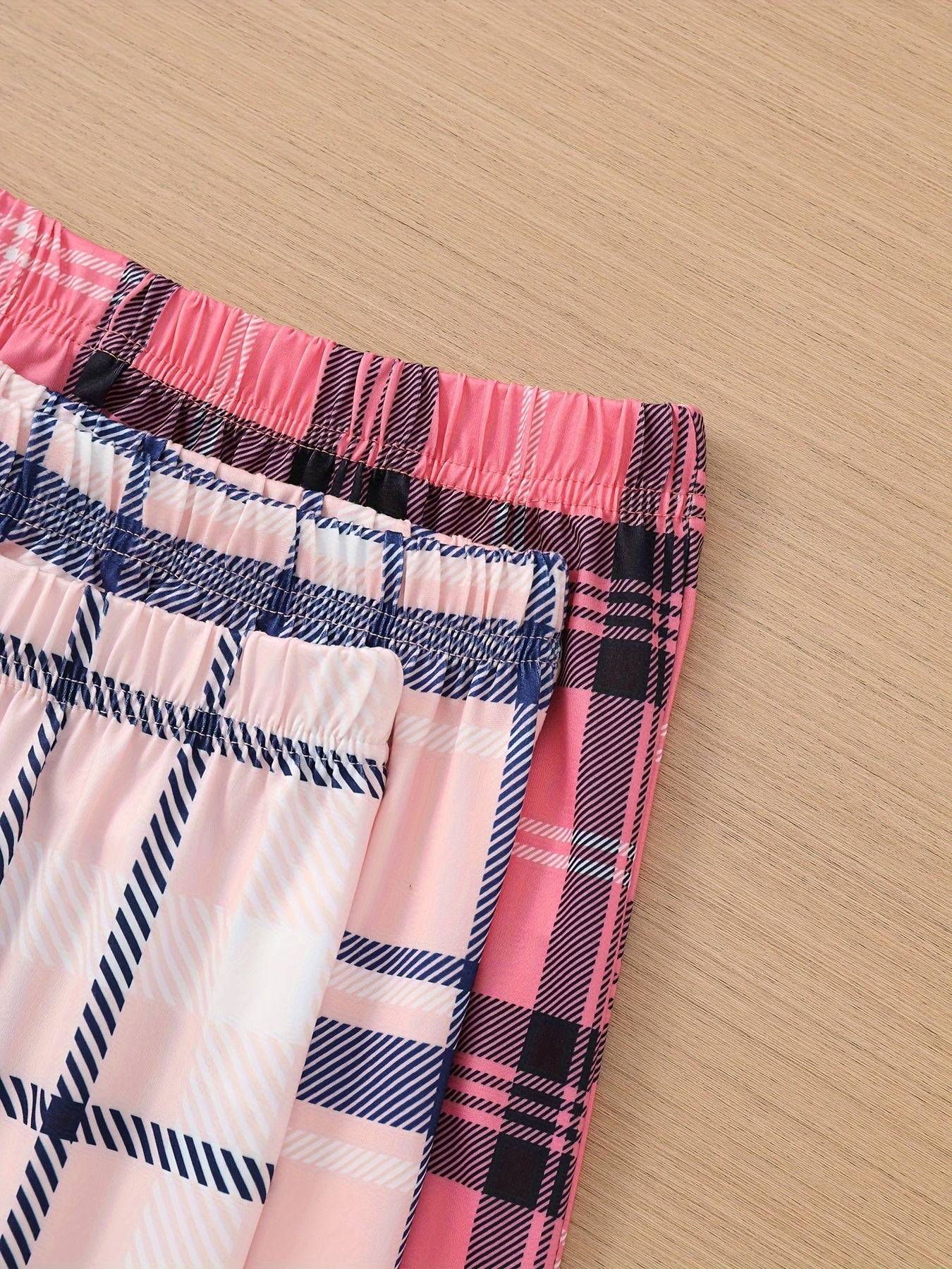 3 Casual lounge pants with plaid print, elastic high waist, and loose fit for women's sleepwear and loungewear.