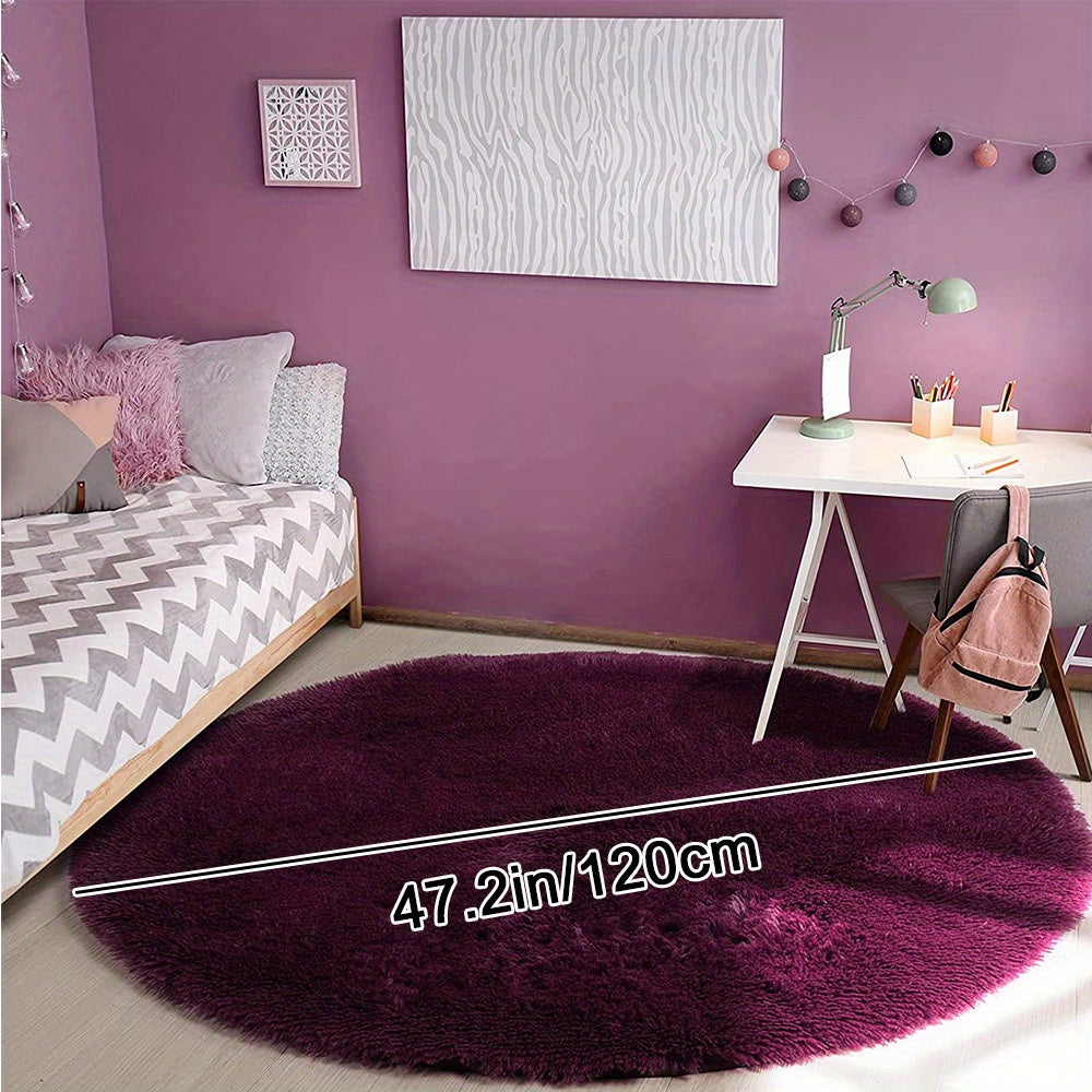 Soft shaggy round rug made of 100% grey polyester. This fluffy area rug is machine washable, fade resistant, and features a low pile tufted weave with PVC backing. Perfect for bedroom, nursery, and kids room decor. Great for gifts on Christmas