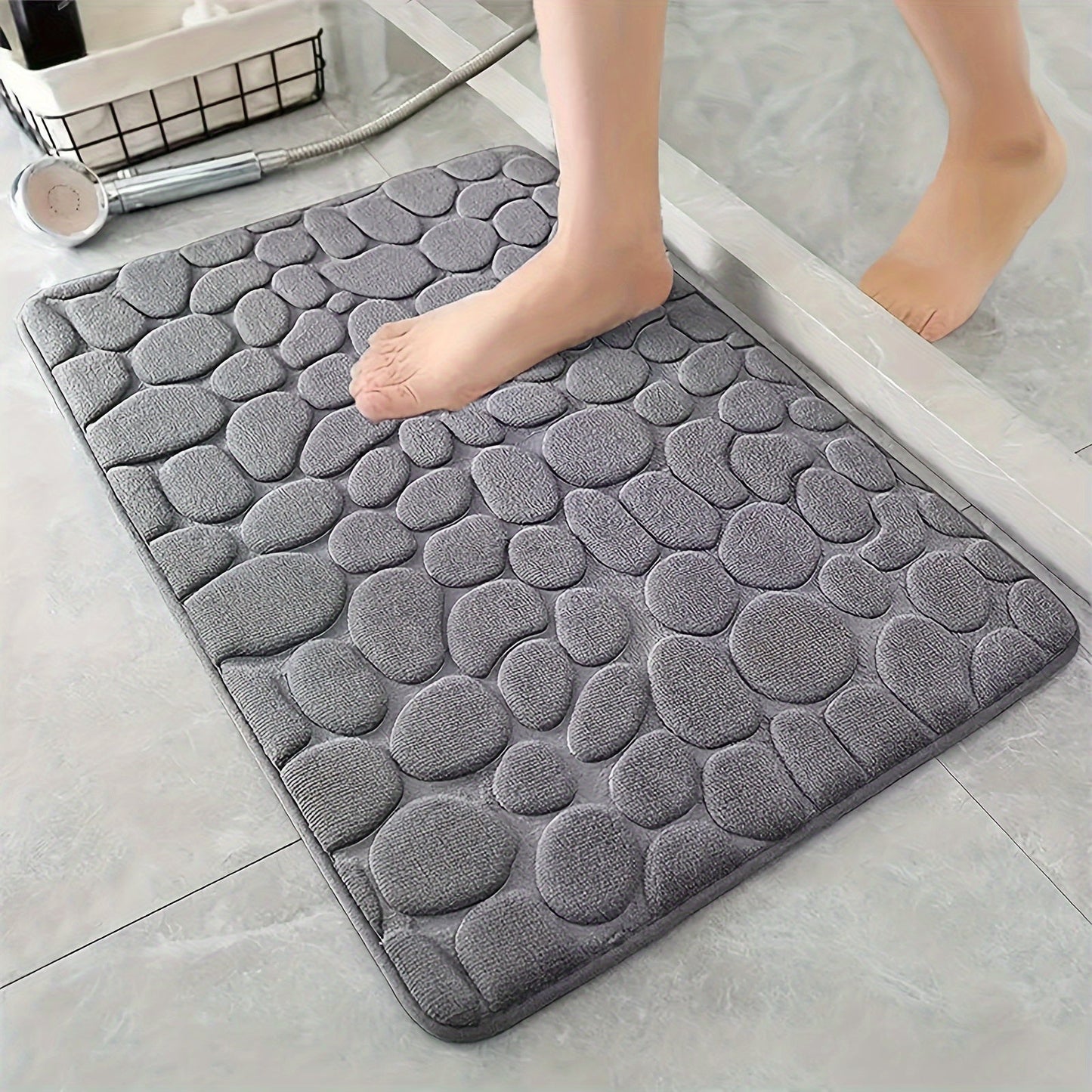 Soft and comfortable Plush Memory Foam Bath Rug featuring Cobblestone Embossment. This quick-dry, non-slip rug is machine washable and perfect for showers and bathrooms. Add a touch of luxury to your space with this ideal fall decor accessory.