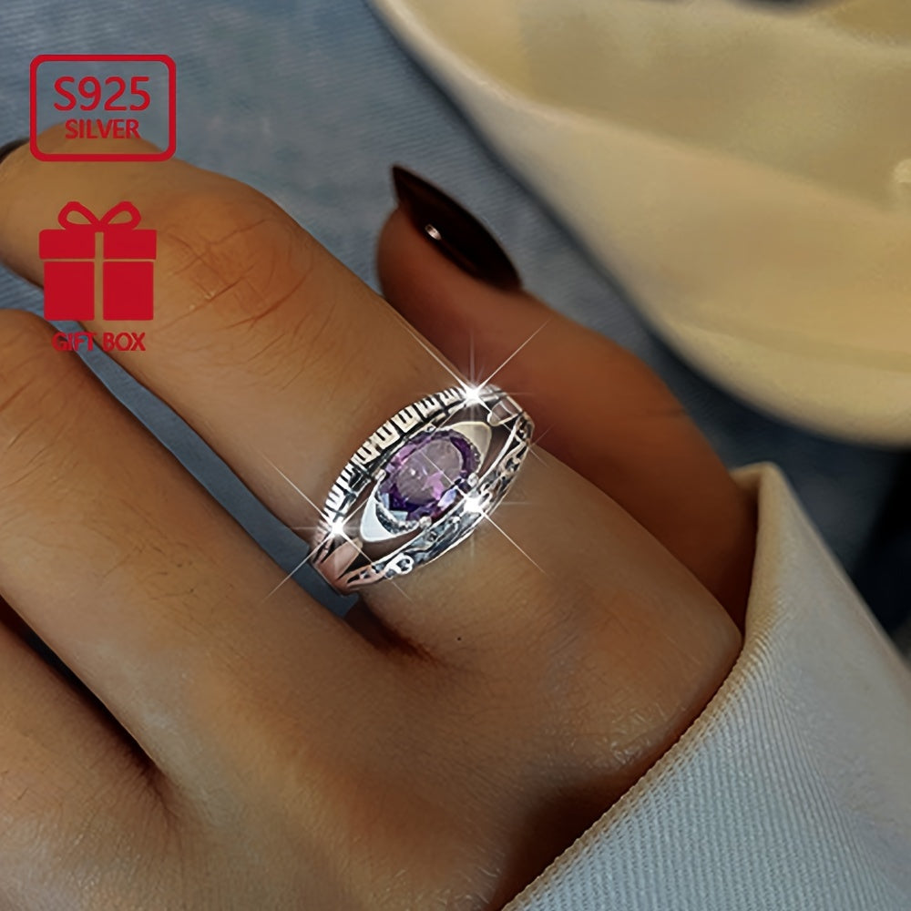 Beautiful and mysterious sterling silver ring with purple waterish zirconia inlay, symbolizing beauty and mystery. This high-quality adjustable ring is perfect for any occasion.