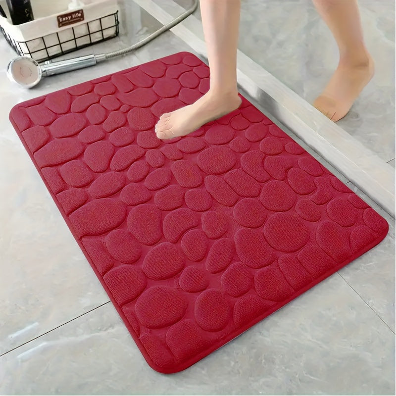 Soft, non-slip coral fleece bathroom mat in a pebble pattern. Quick-dry, machine washable, and low pile for comfort and home decor. Made of plush polyester fiber with knit fabric and 100% polyester material. 570gsm and 1.4cm thick.