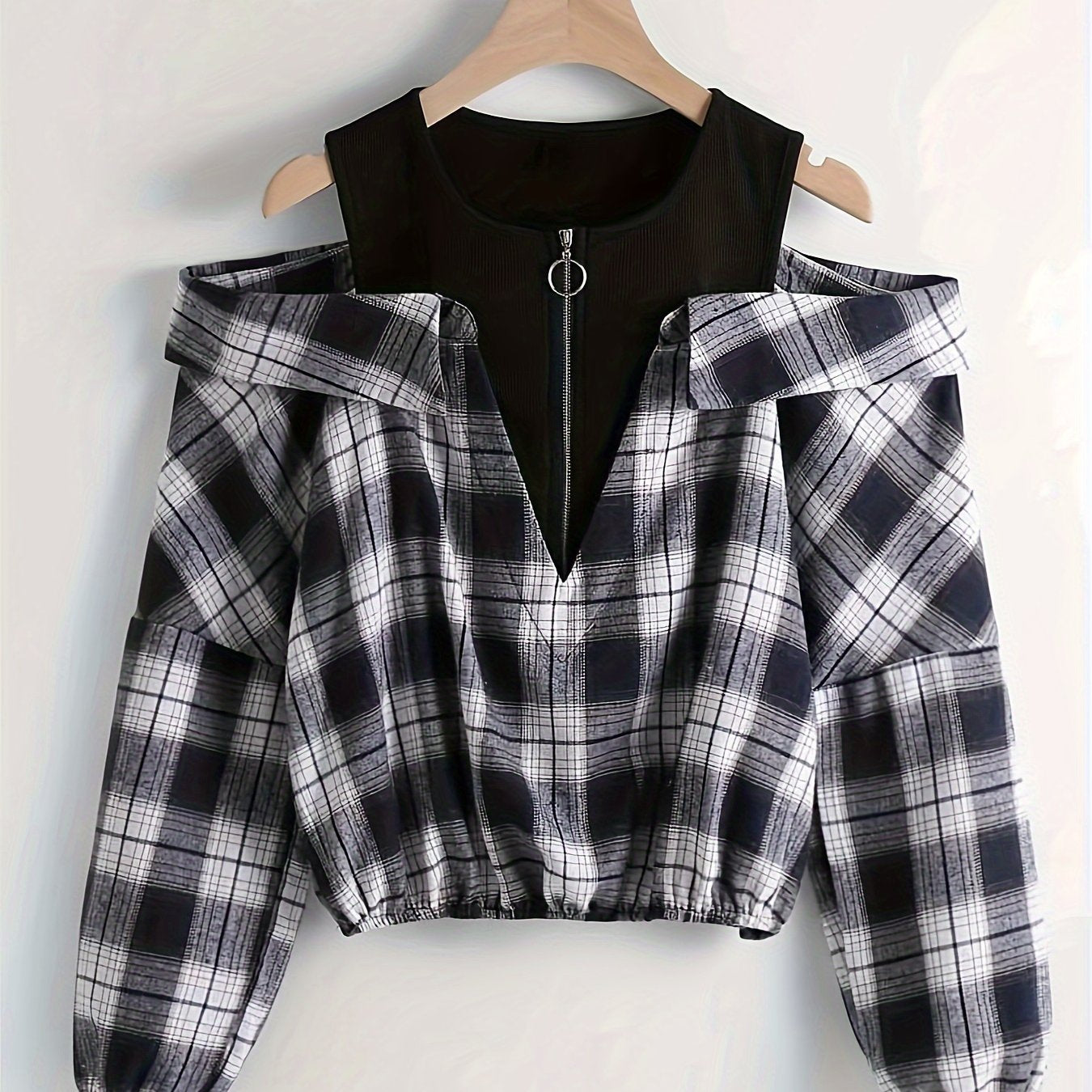 Cold shoulder plaid print blouse with long sleeves and quarter zip, suitable for spring and fall.