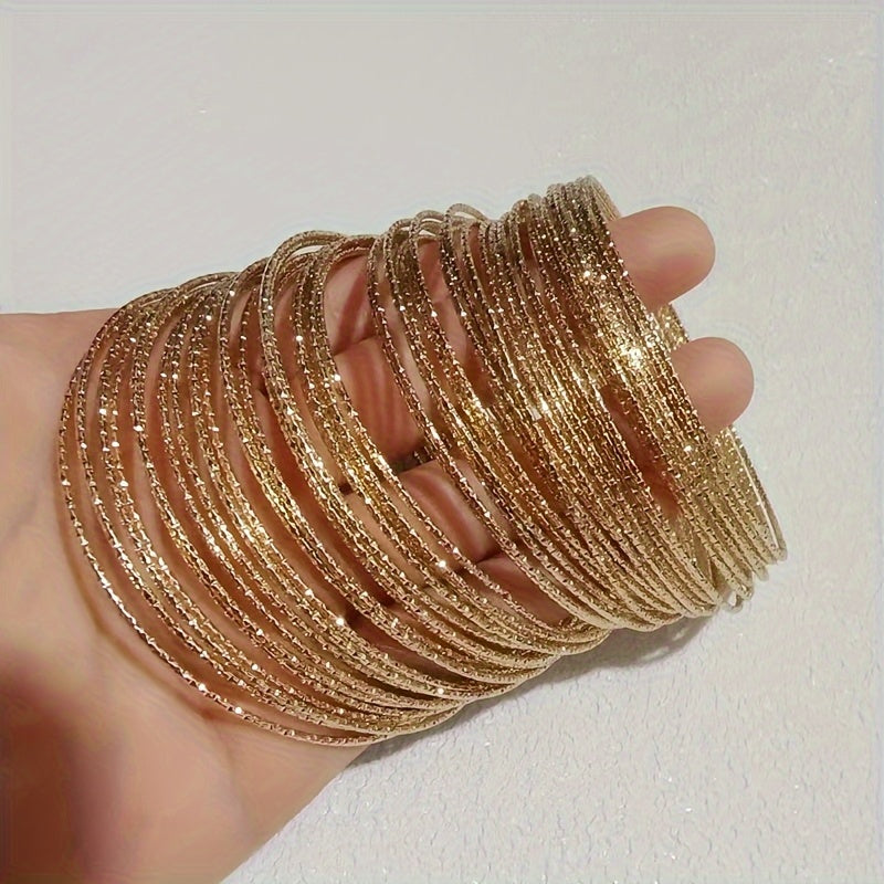 A collection of 30/50 fashionable golden bracelets for women, designed to resemble stars in the sky. These bracelets are perfect for daily wear or make a great gift for vacation.