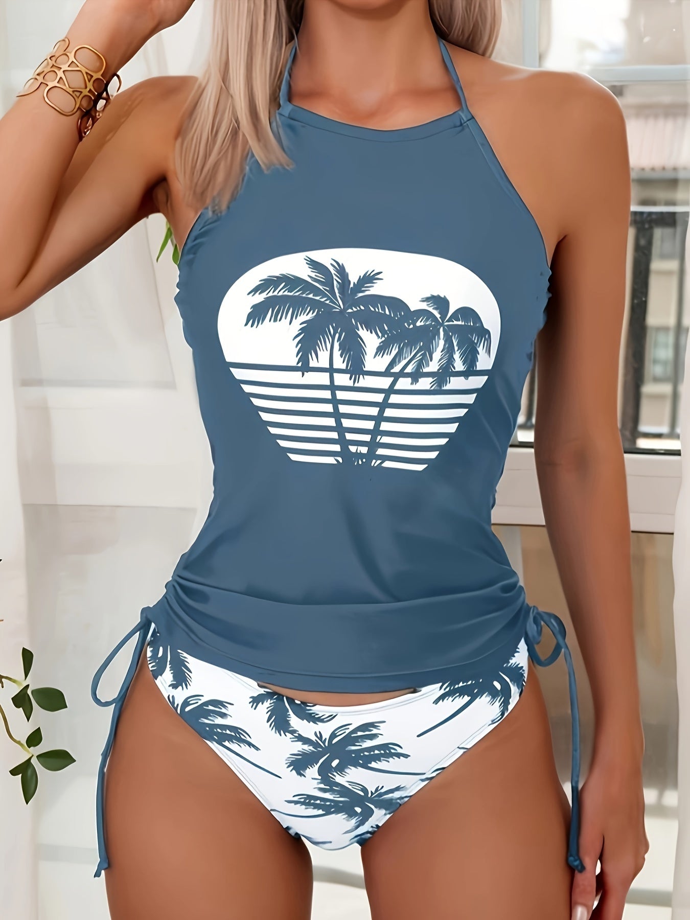 Padded bra swimsuit with palm tree print.