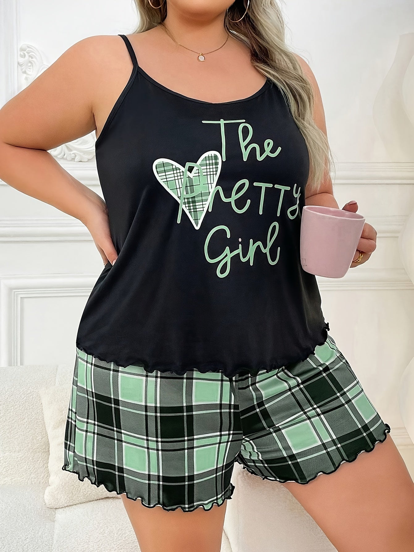 Women's sexy casual pajama set featuring a heart-print sleeveless top with ruffle hem, made of knit polyester fabric. This set includes a cartoon pattern, spaghetti strap collar, and slight