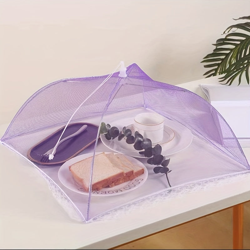 White portable mesh food cover for picnics and travel, protecting food from insects and dust.