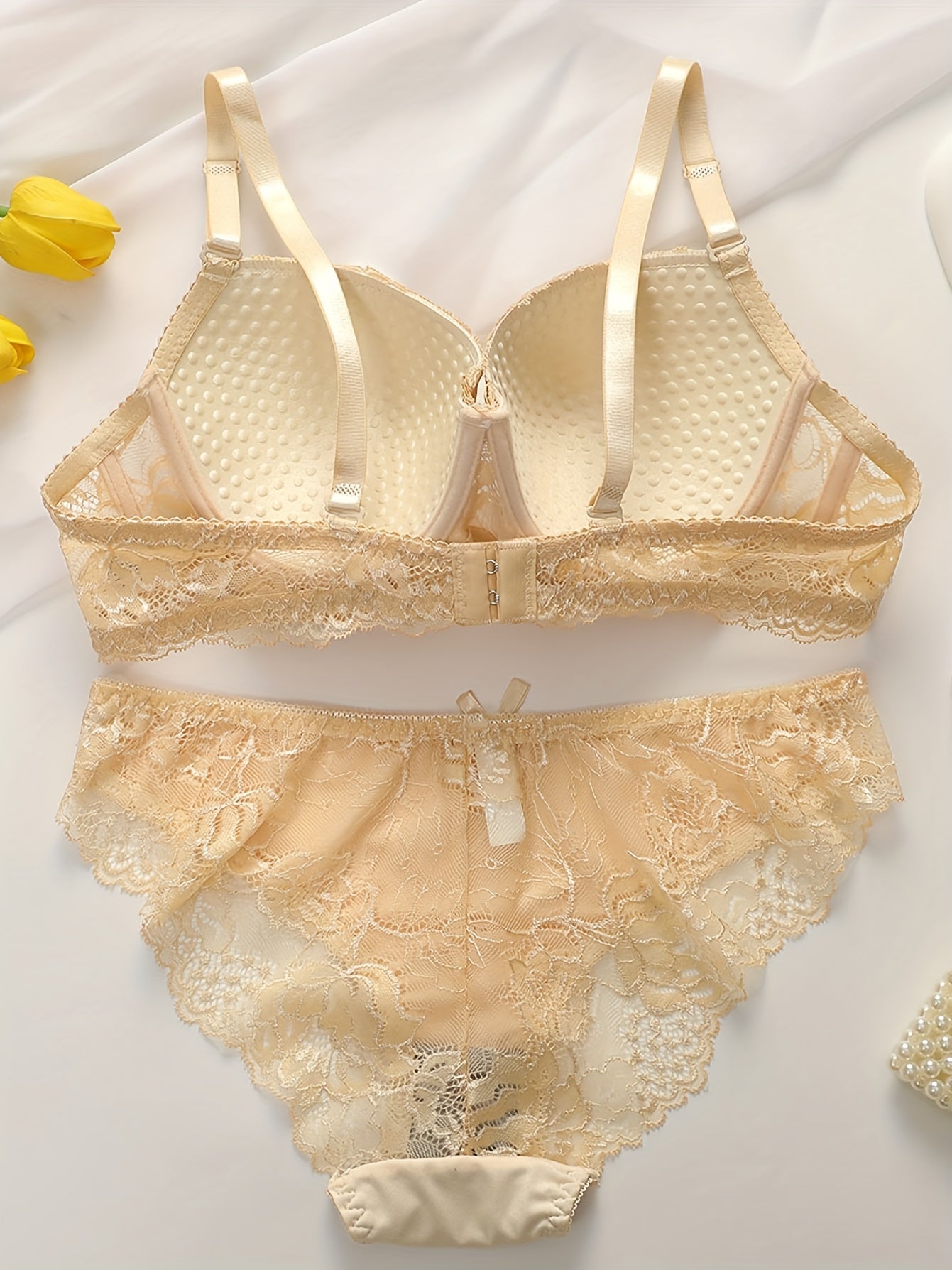 Floral lace lingerie set includes push up bra with adjustable straps and matching see-through briefs.