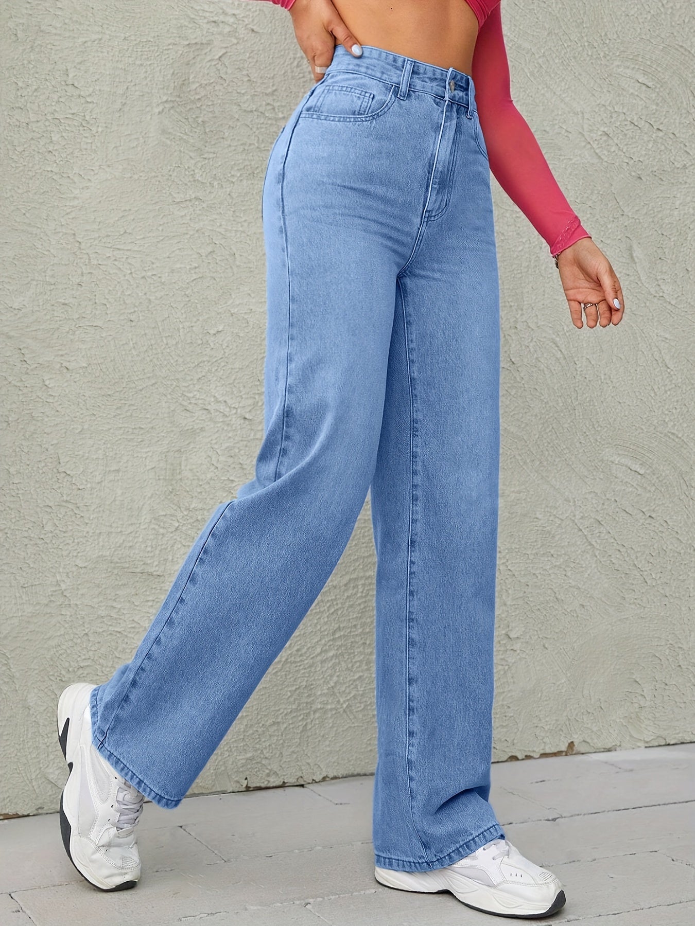 Sky blue wide leg jeans for women with high waist, loose fit, and medium elasticity.