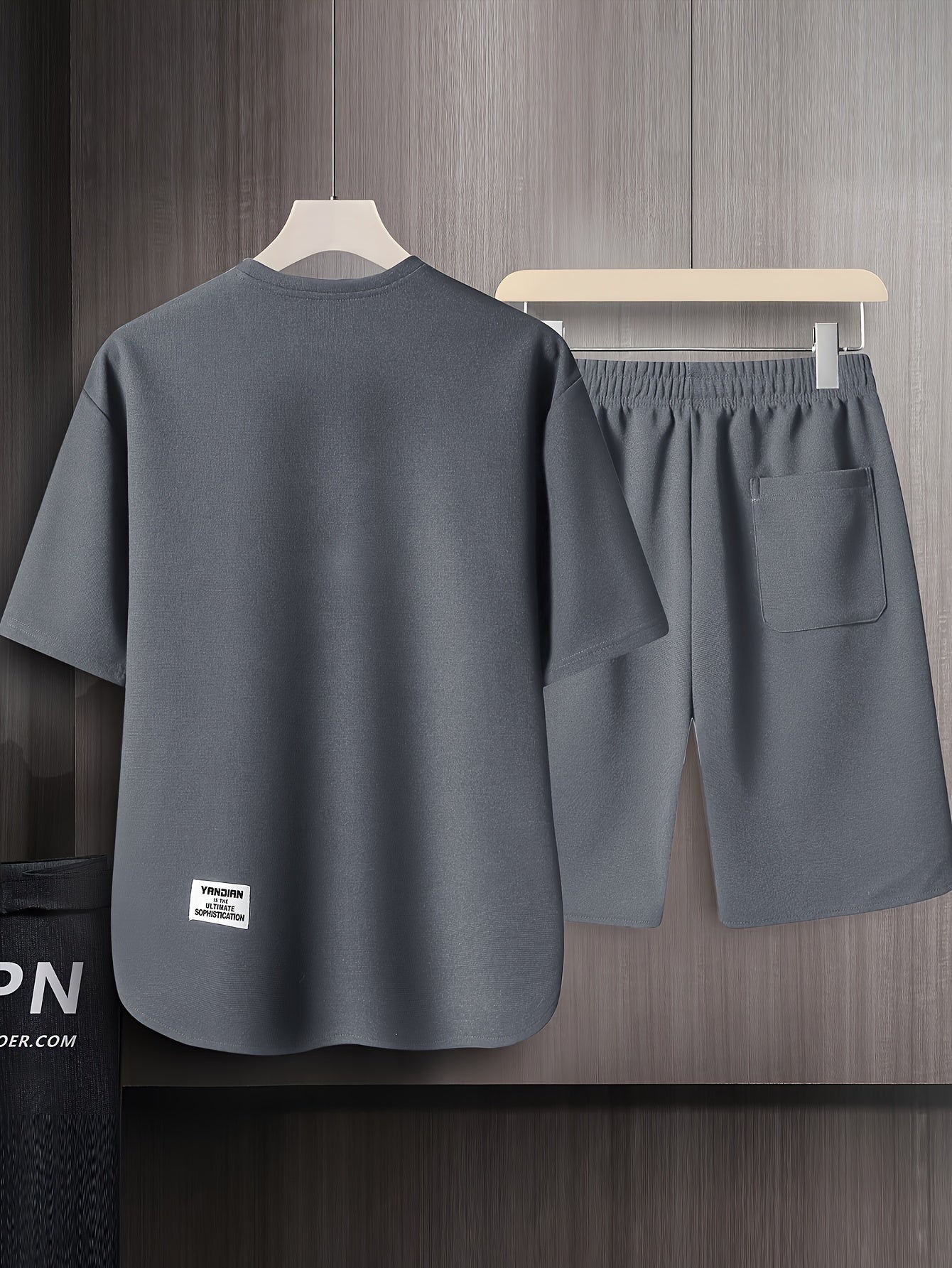 Men's summer short sleeve suit with high-end solid color round neck t-shirt and breathable thin shorts in a two-piece set called AWESOME BIRD.