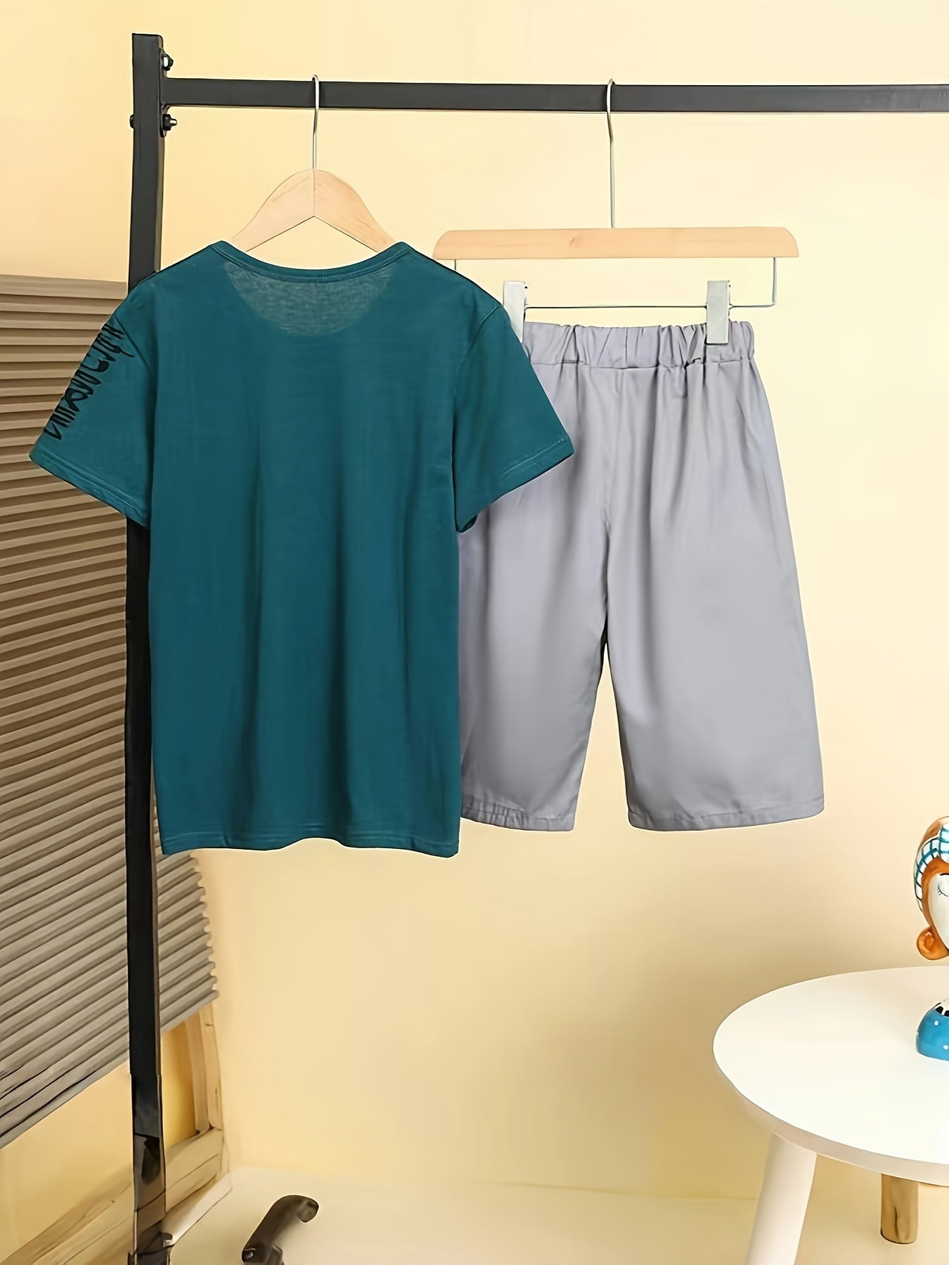 Boys' two-piece set with glasses print t-shirt and shorts, ideal for summer outdoor activities.