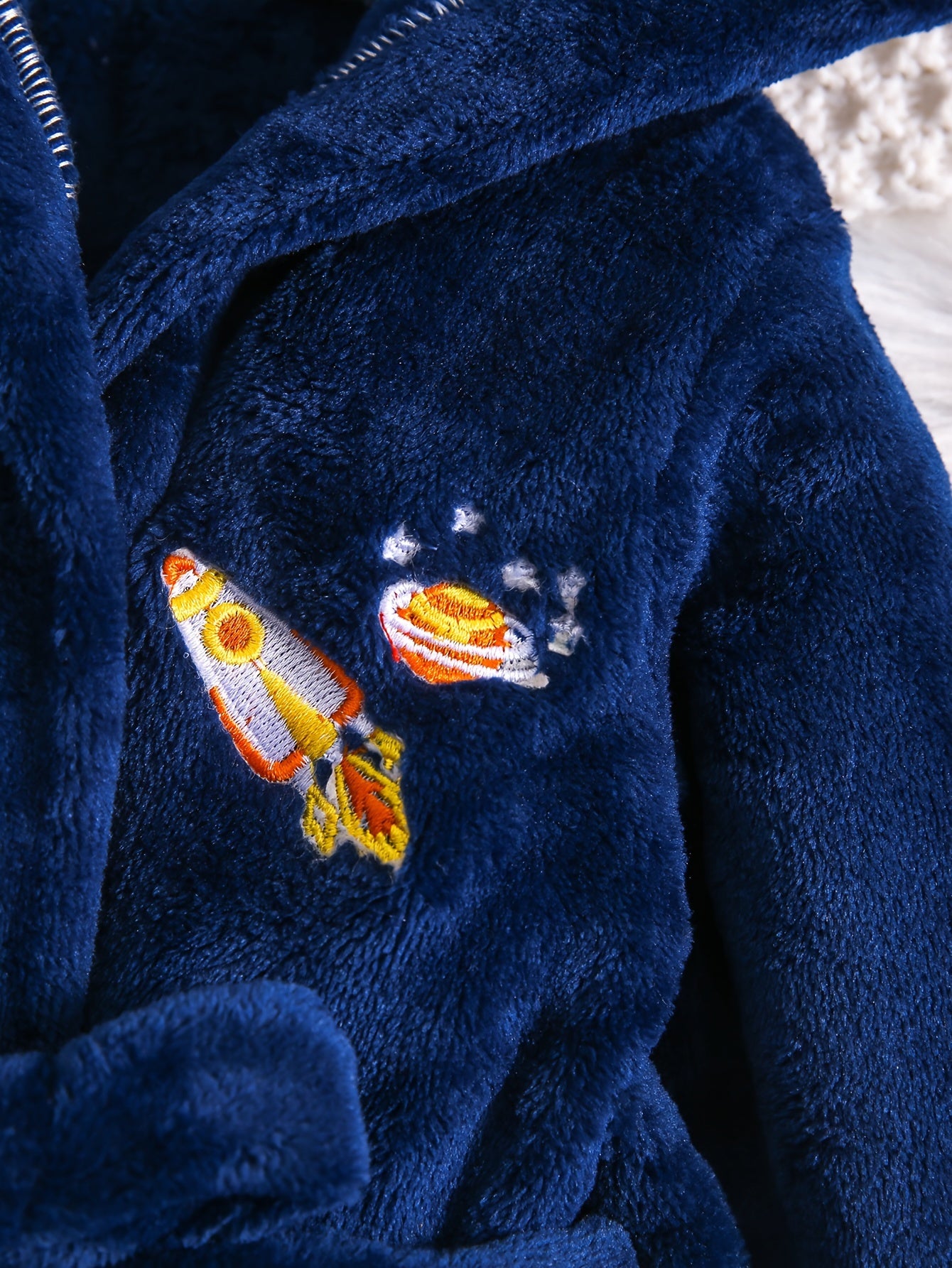 Blue flannel hooded bathrobe with rocket embroidery - cozy, thick, and machine washable for kids