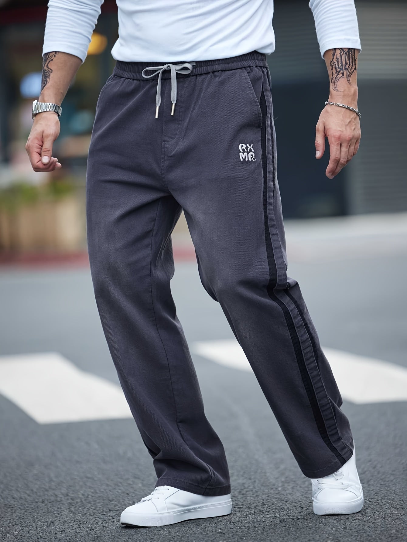 Men's cotton blend label decor straight leg pants with drawstrings for casual sports in spring and fall.