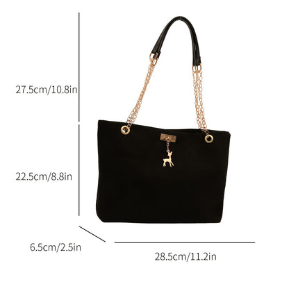 Stylish deer pendant women's tote bag with large capacity, golden-tone chain straps, black color, magnetic closure, versatile for everyday use.