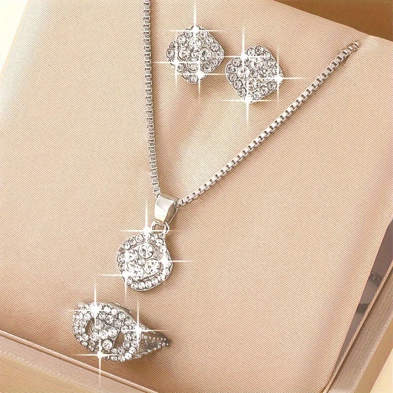 Alloy pendant necklace, earrings, and ring set designed for men.