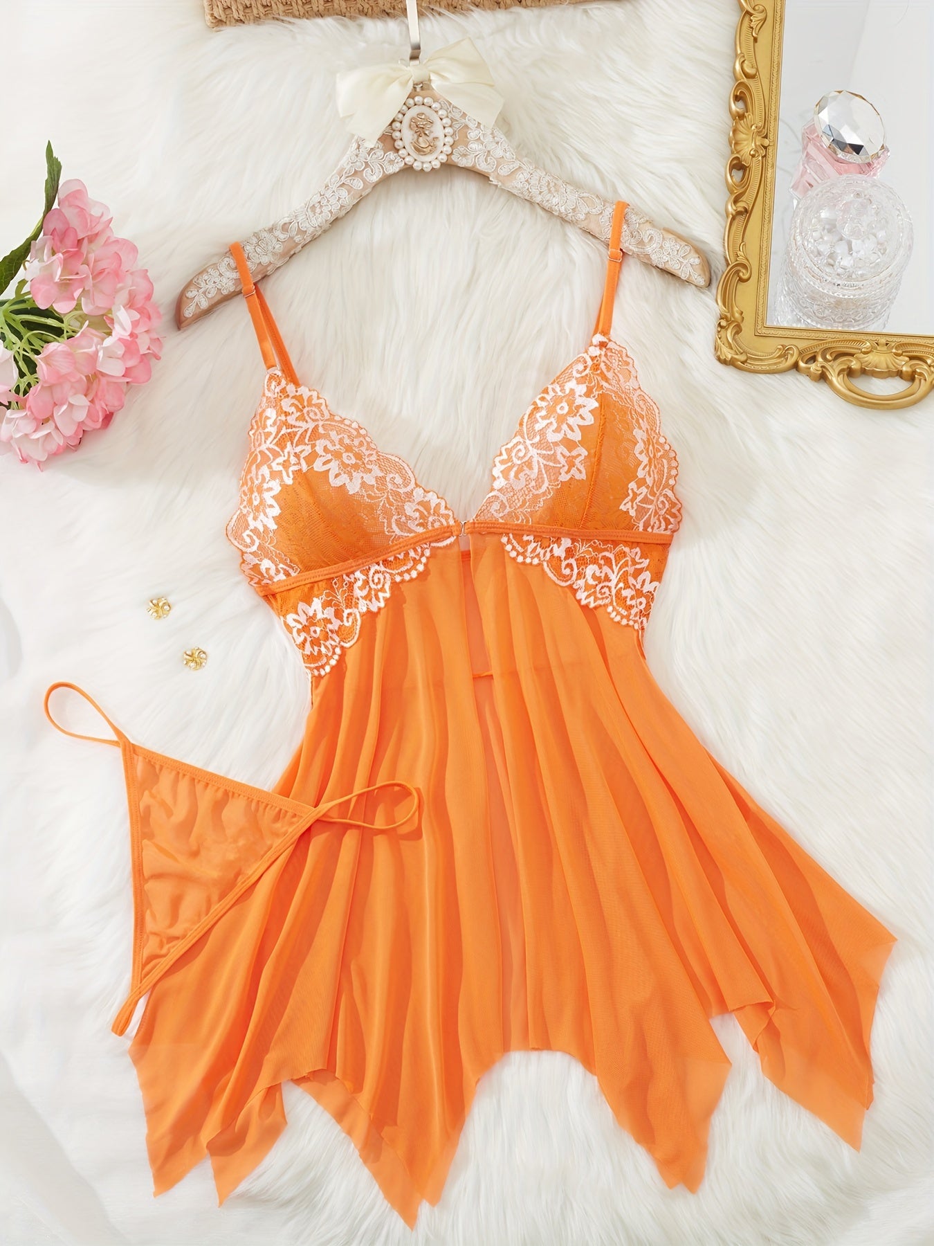 Stylish lace babydoll dress set with thong, featuring V-neck, backless design, floral patterns, and soft polyester blend. Perfect for romantic evenings.