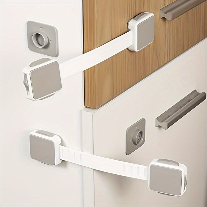 Set of 4 Gray Safety Strap Locks for securing fridge, drawers, oven, cabinets, toilet, dishwasher without the need for drilling. Features adhesive for easy installation.