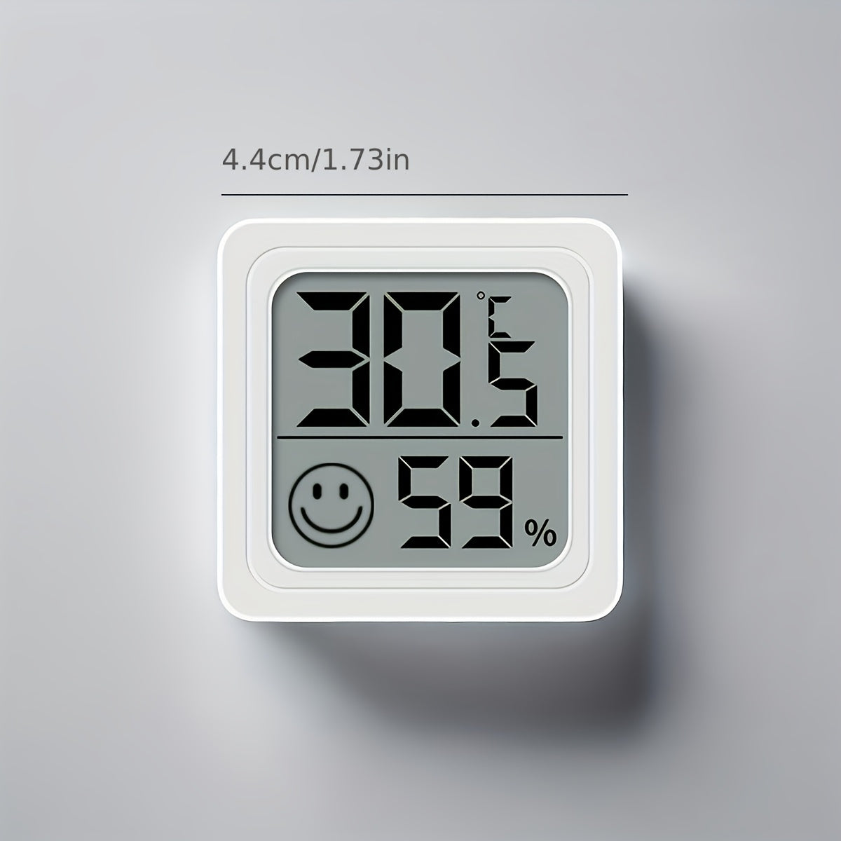 Compact digital hygrometer & thermometer for indoor/outdoor use in kids' rooms, cars, and beyond. Battery-operated with large display showing temperature, humidity, and smile icons.