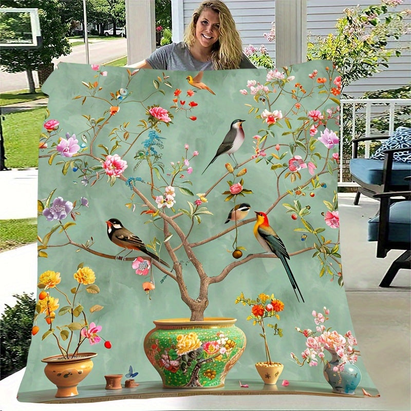 Soft, Portable Green Floral & Bird Print Fleece Blanket. This tear-resistant and stain-proof blanket is made from 100% polyester, offering all-season comfort. Perfect for home decor and travel, it is also machine washable for easy care.