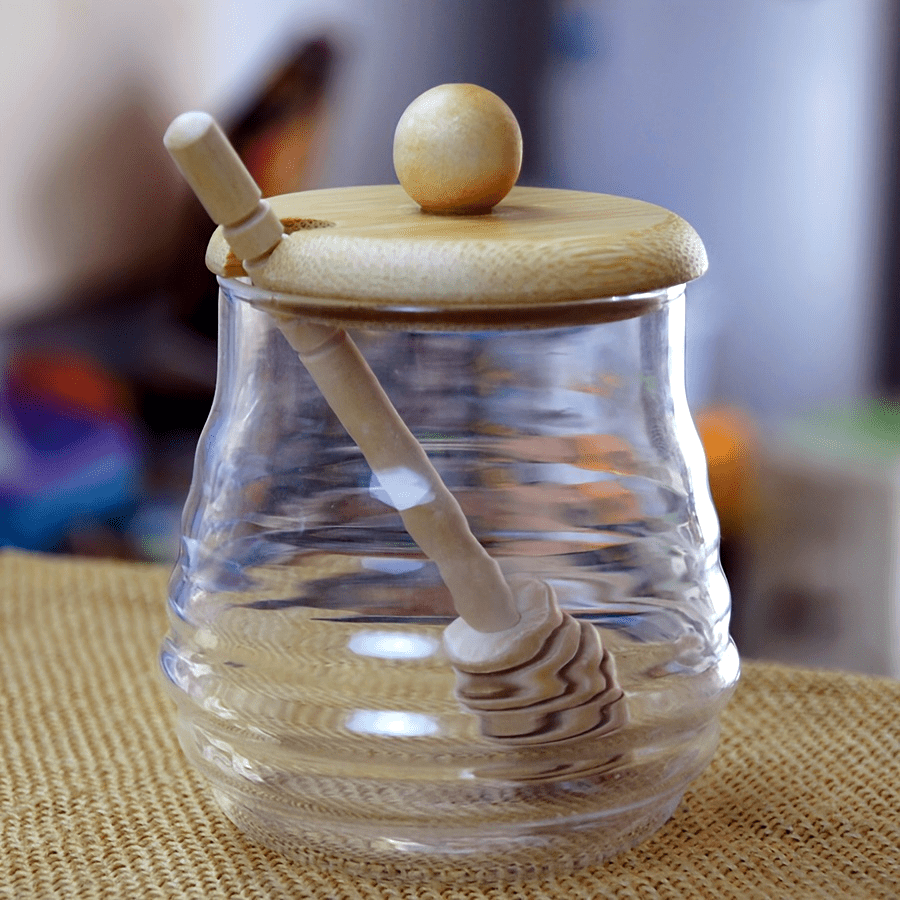 Glass honey jar with bamboo lid and dipper - ideal for kitchen storage and baking essentials