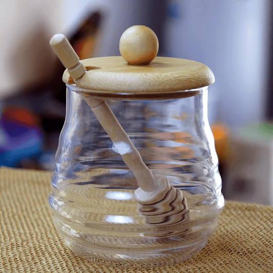 Glass honey jar with bamboo lid and dipper - ideal for kitchen storage and baking essentials