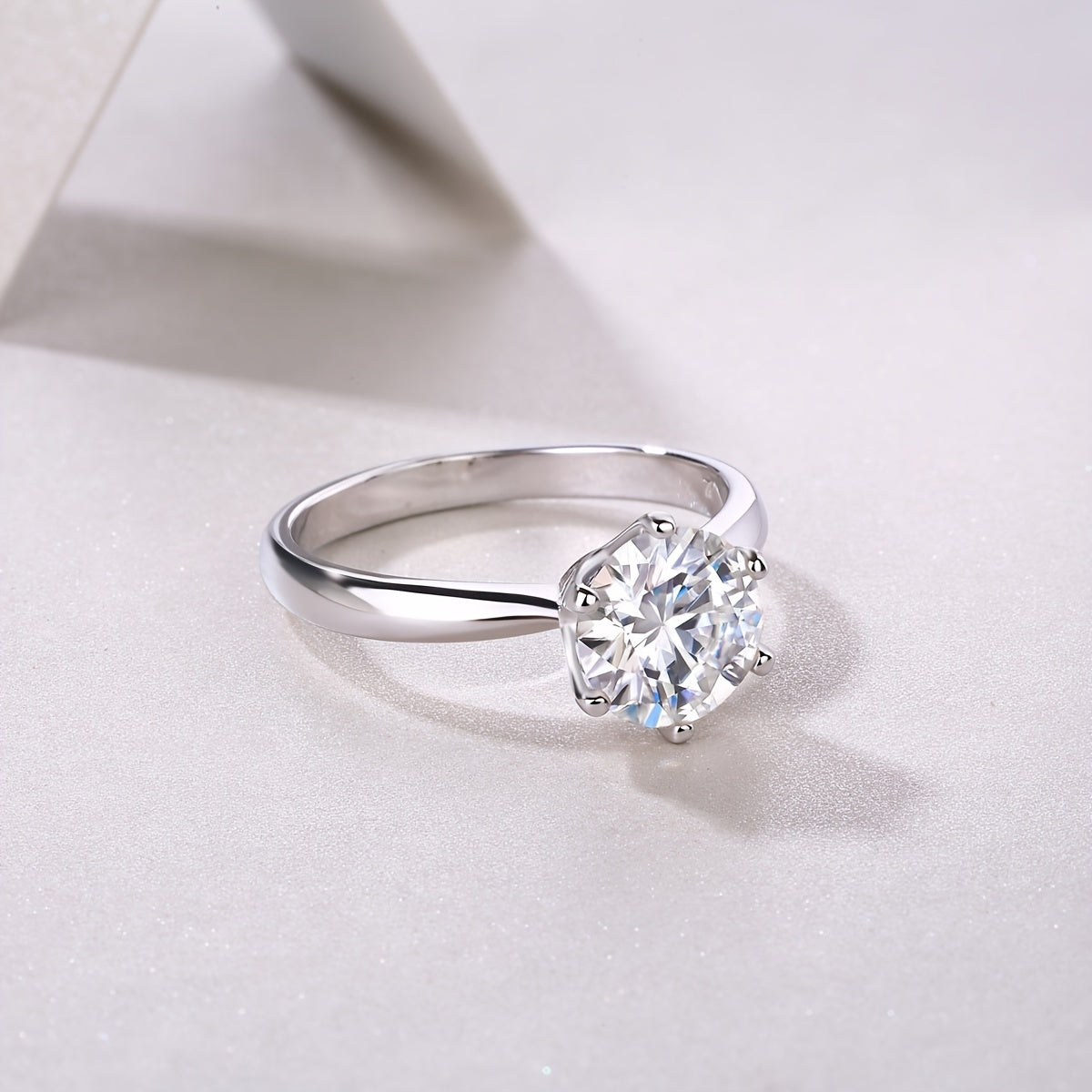 This stunning Classic Six-Prong Moissanite Promise Ring is available in 1, 2, 3, or 5 carat options. Crafted from 925 sterling silver and plated with 18k gold, this high-quality jewelry piece is perfect for engagements or marriages. It is a truly special