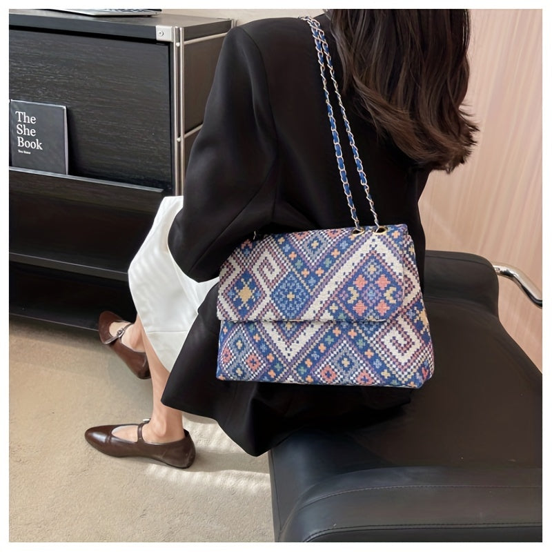 Colorful geometric shoulder bag for women with adjustable strap, magnetic closure, foldable ethnic style, and polyester lining.