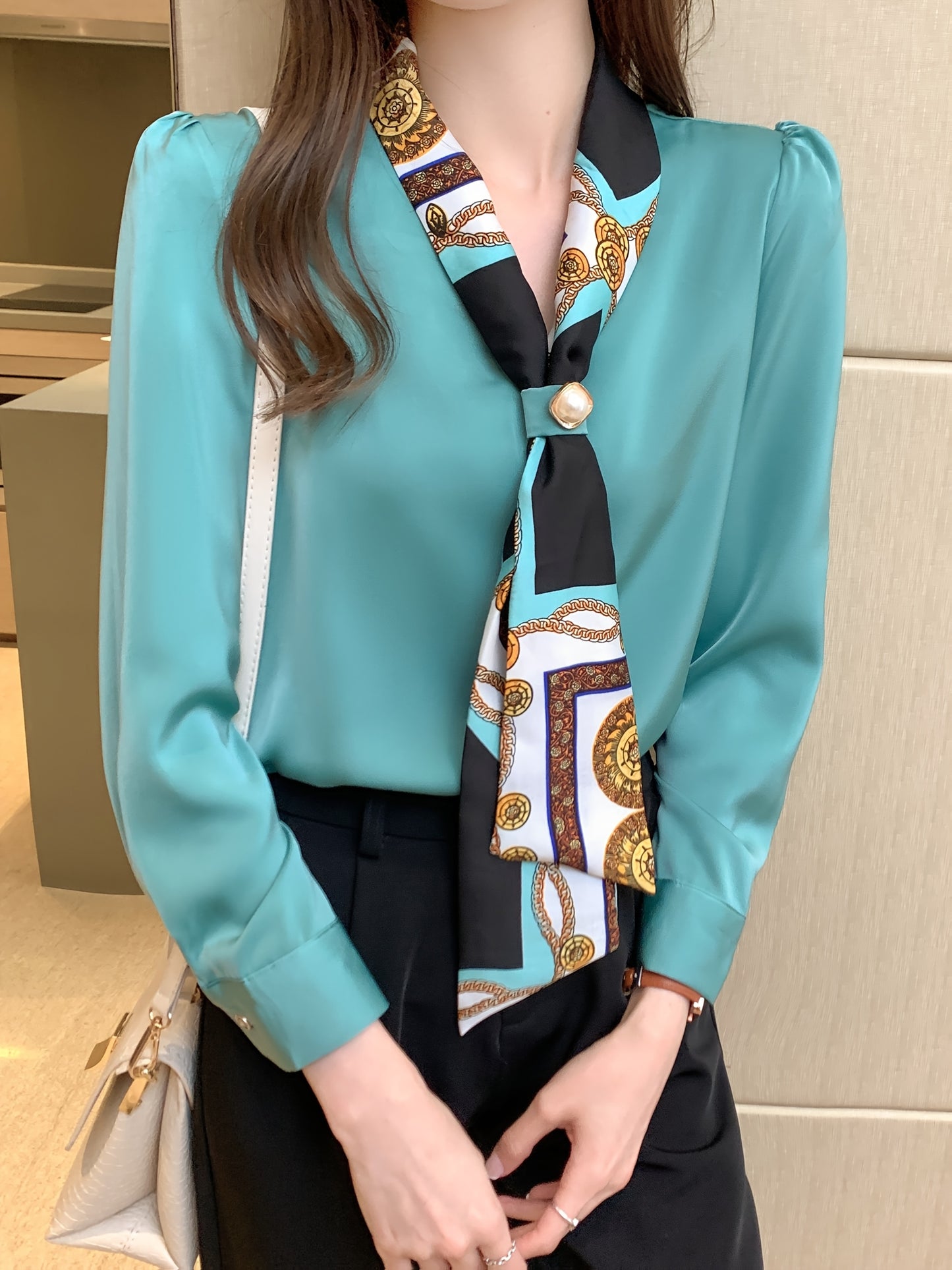 Polyester tie neck blouse with long sleeves, button detail print for women. Regular fit woven top, fashionable all-season style.