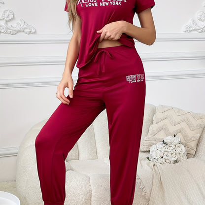 Slogan print pajama set for women, including short sleeve t-shirt and drawstring joggers.