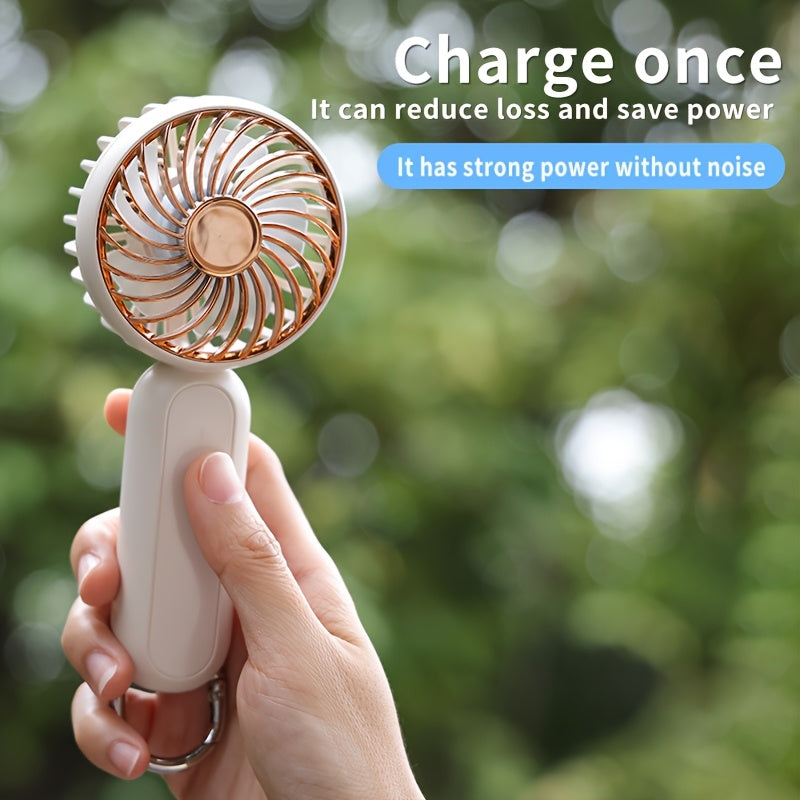 This mini portable fan is perfect for those on the go. It is handheld, personal, USB rechargeable, and battery-operated. You can bring it to the office, bedroom, outdoor travel, and camping. It also comes with a hook loop for easy carrying and