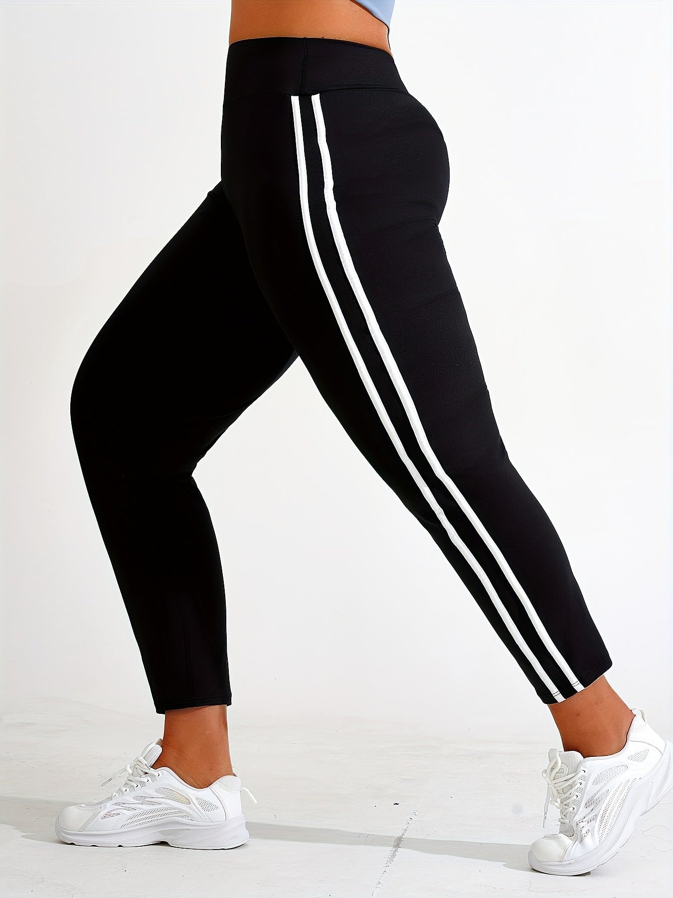 Plus size yoga pants for women, solid color, slimming fit, machine washable, long length, made of stretch polyester and elastane.