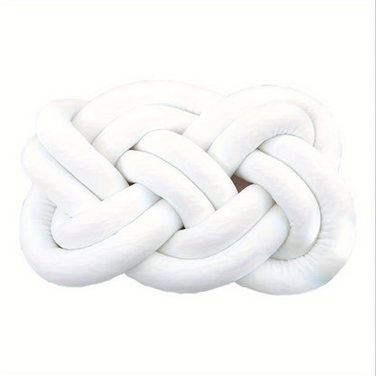 Knotted throw pillow for home decor, suitable for bed or sofa.