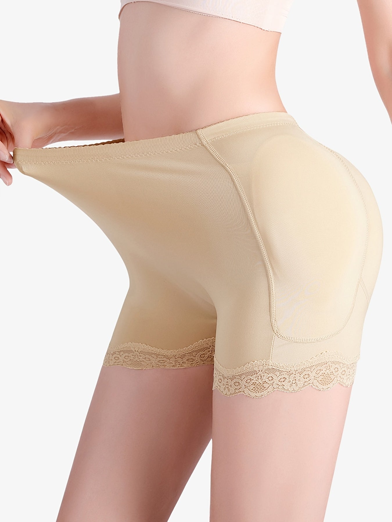 Lace hem hip-lifting corset with buttock padding.