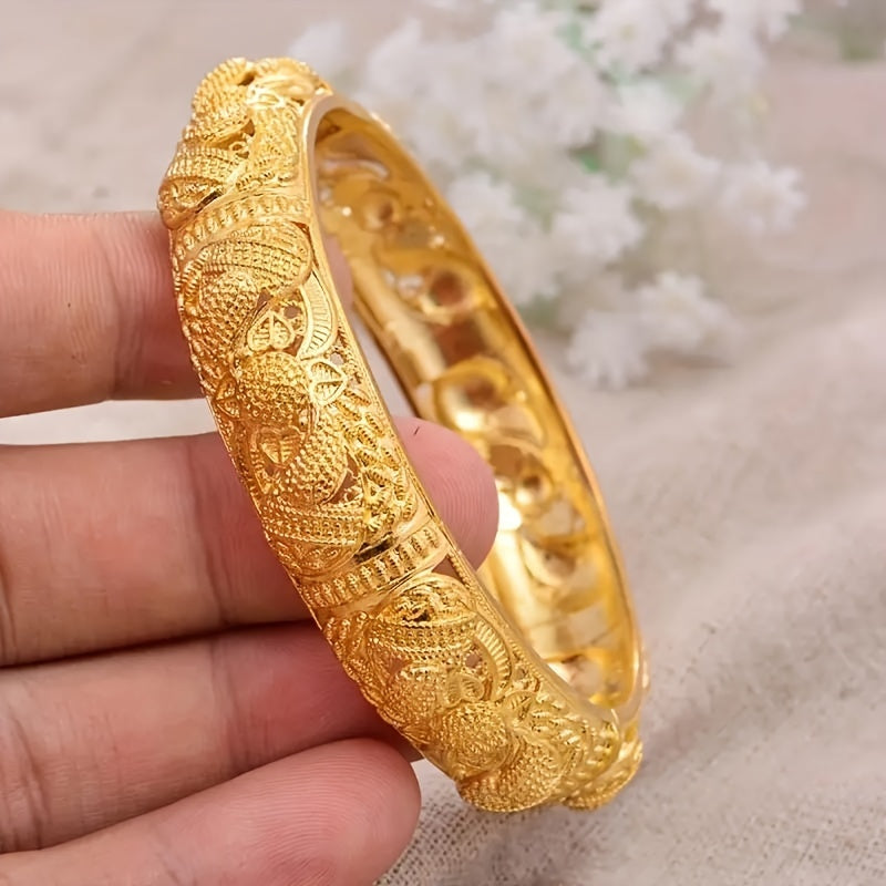 Handcrafted from 24K gold plated copper, this cuff bracelet features a tribal luxury hollow flower design. It makes for a stunning traditional engagement or wedding jewelry gift for women, with no mosaic material used in its creation. Perfect for daily