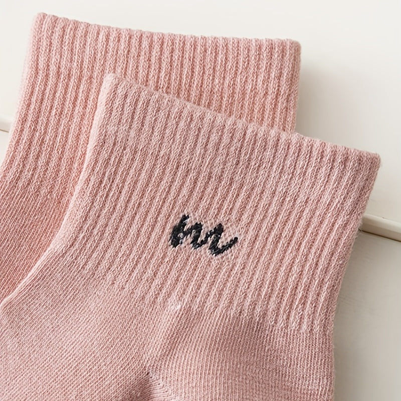 7 pairs of women's mid-calf rib-knit socks in trendy candy colors with solid color and letter detail, made of 95% polyester and 5% spandex. Medium crew length with 300g/m² knit fabric.