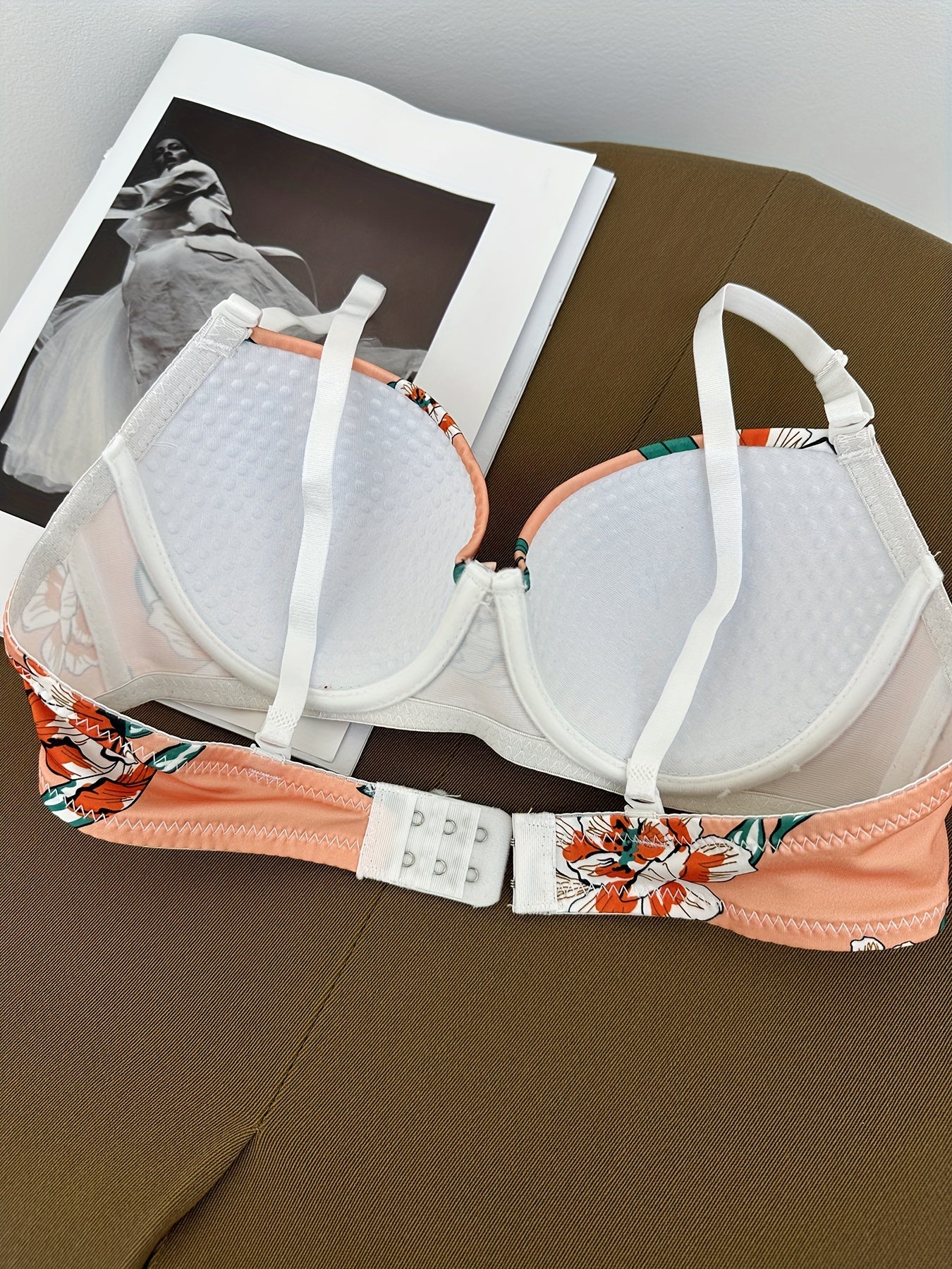 Floral bra and panty set with steel underwire and breast enhancement feature for women.