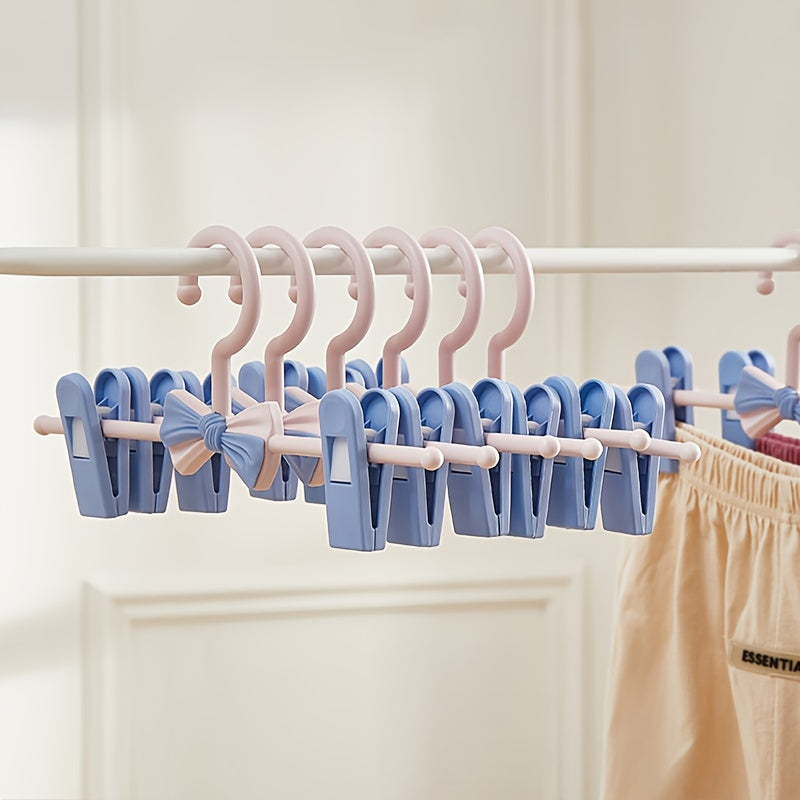 Convenient 27.94-68.58 cm Retractable Plastic Pants Hanger with Bow Clips - Ideal for Children's Clothing