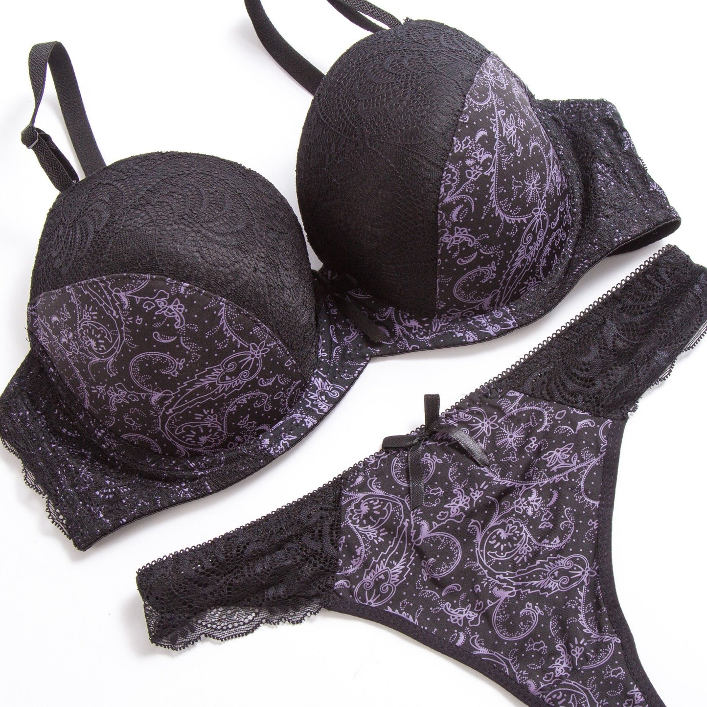 Sophisticated lace bra and panty set in beige and black floral print. Hand washable nylon blend for comfort and versatility. Perfect for casual wear or special occasions. Smooth texture