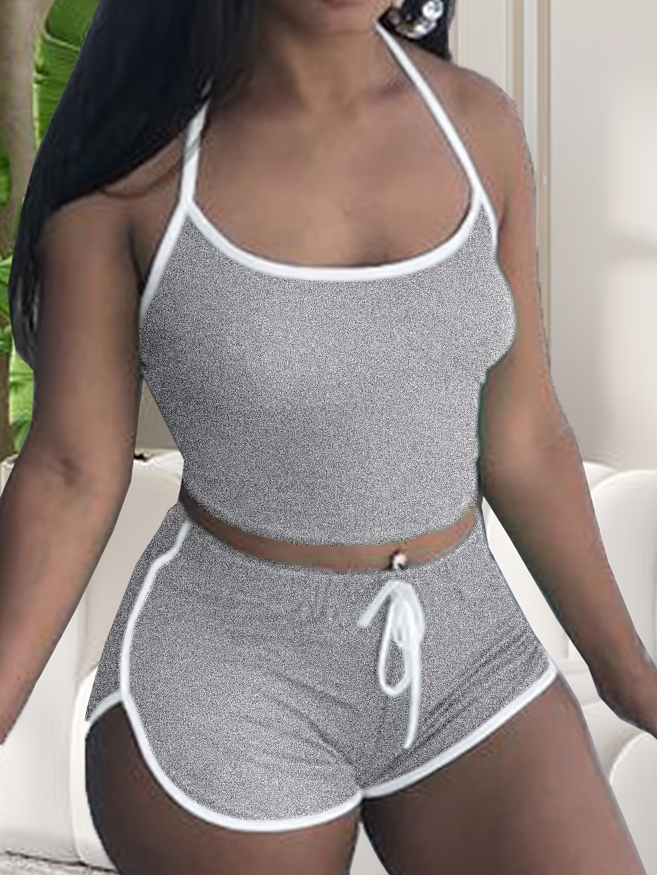 Stylish lounge set with halter neck crop top and elastic shorts for women's sleepwear.