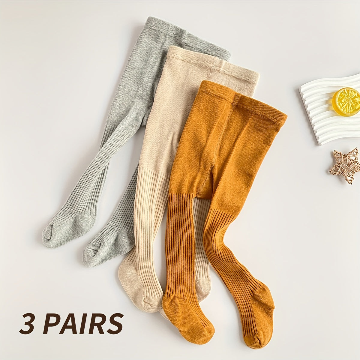 3-pack Soft & Breathable Girls' Leggings Socks in Light Gray, Beige, & Brown. 3.5% Spandex/96.5% Polyester. Sweat-absorbing for year-round wear. Hand wash only. Cute design.