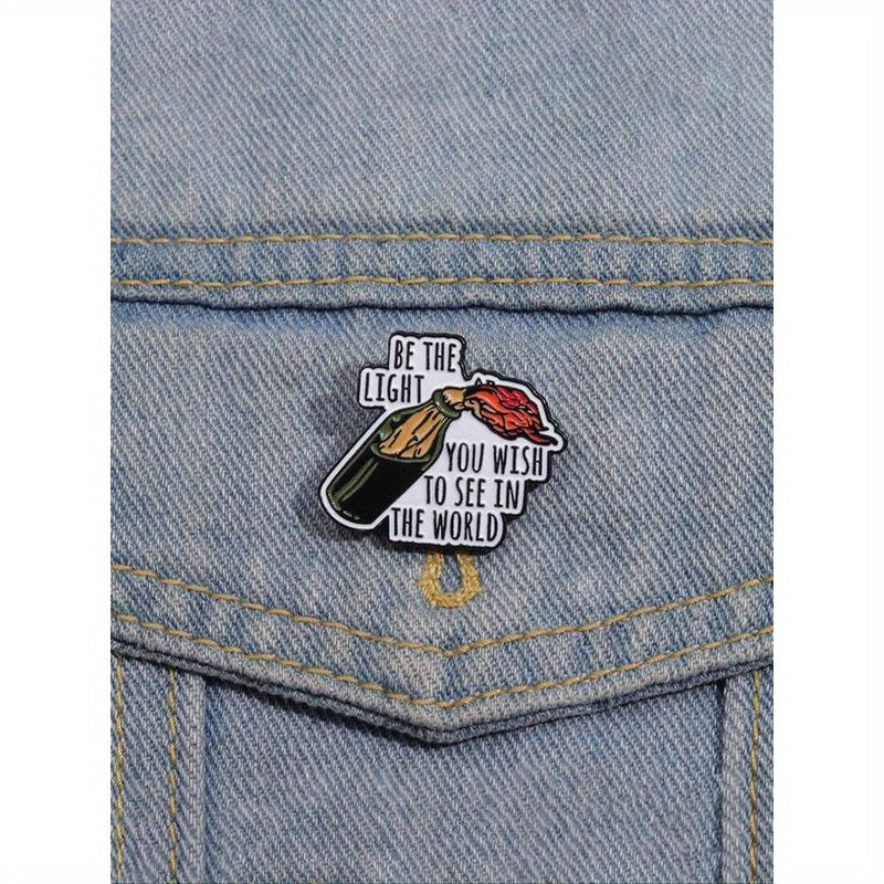 Enamel Pin Brooch with Inspirational Quote: "Be the Light" - Motivational Design for Fashionable Backpacks, Jeans, Scarves, Hats. Trendy and versatile, perfect for outdoor use. Makes an ideal birthday gift.