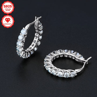 These earrings are made of 925 sterling silver and feature a pair of round Moissanite stones measuring 3mm each, with a total weight of 1.5 carats. The earrings are adorned with 30 Moissanite stones in total, each weighing 3.74 grams. This elegant design