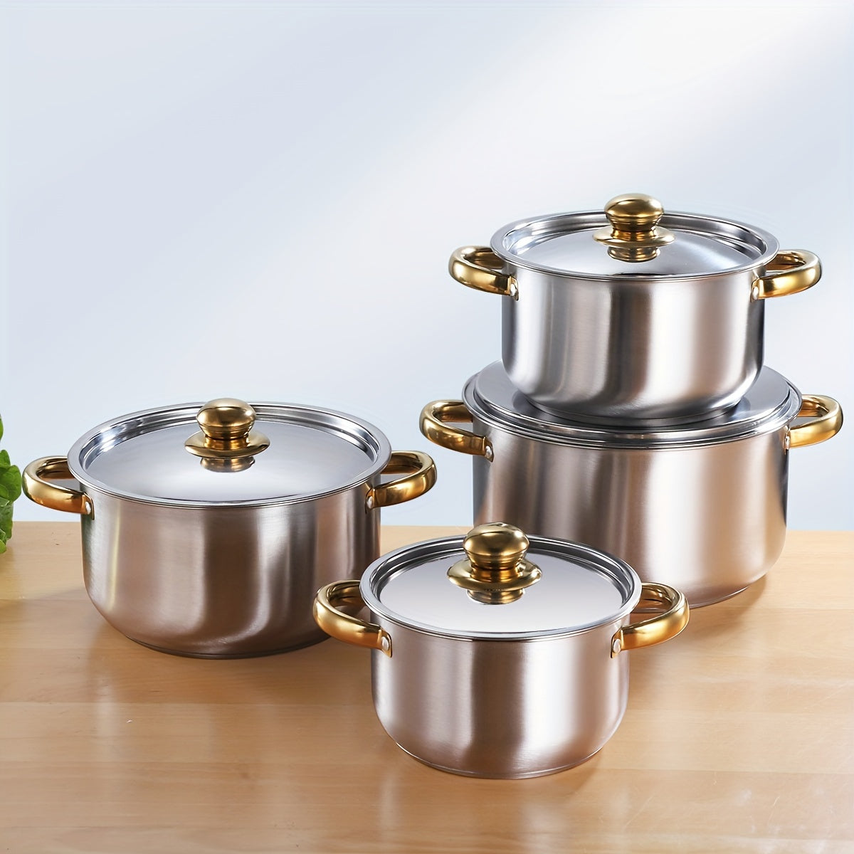 Set of 4 thickened soup pots made from 410 stainless steel with composite bottoms in sizes 18cm, 20cm, 22cm, and 24cm.