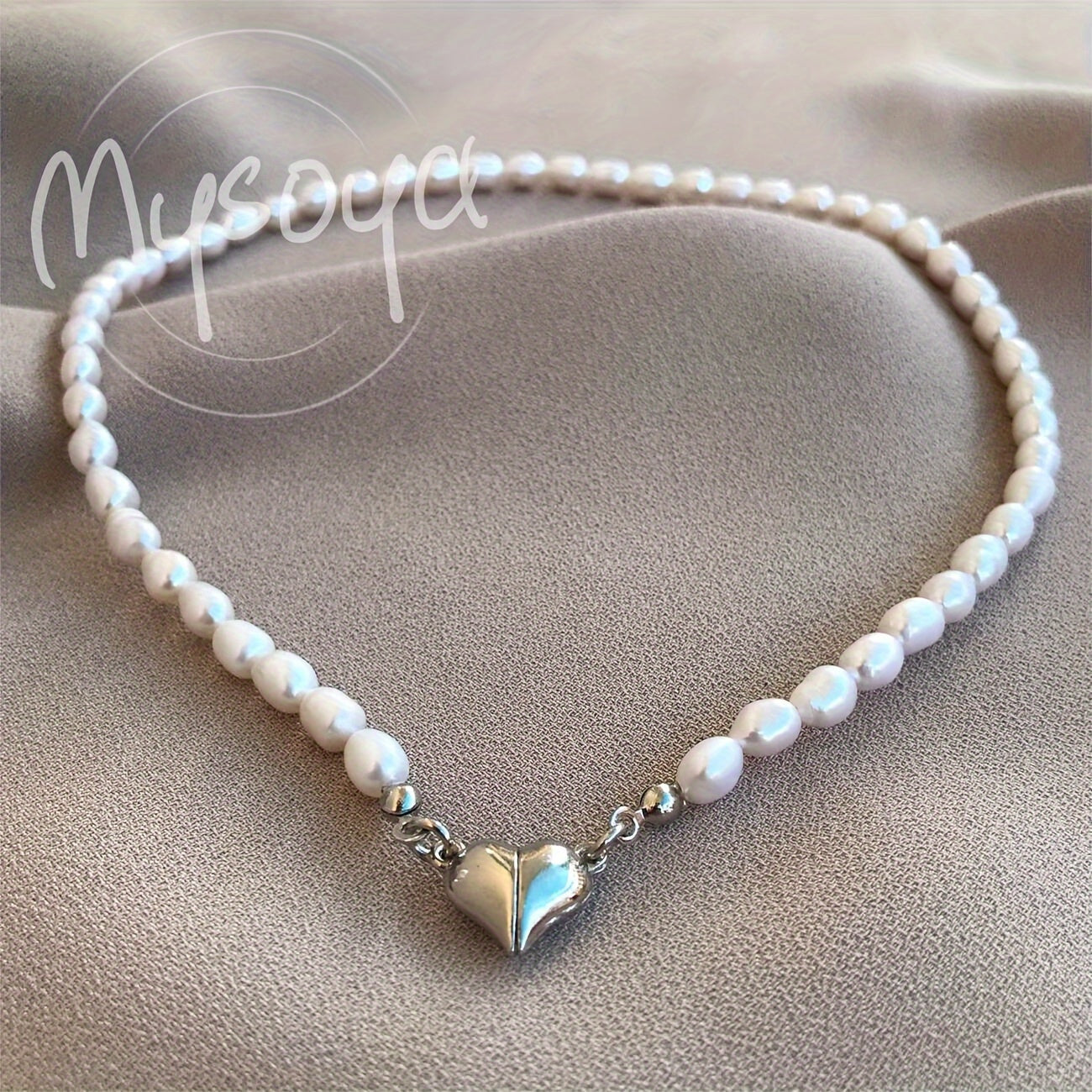 MYSOYA presents a stunning handmade necklace featuring natural freshwater rice-shaped pearls, adorned with a golden or silvery heart. The 6-7mm pearls come beautifully packaged in a gift box, making it a perfect jewelry gift for him or her. Ideal for