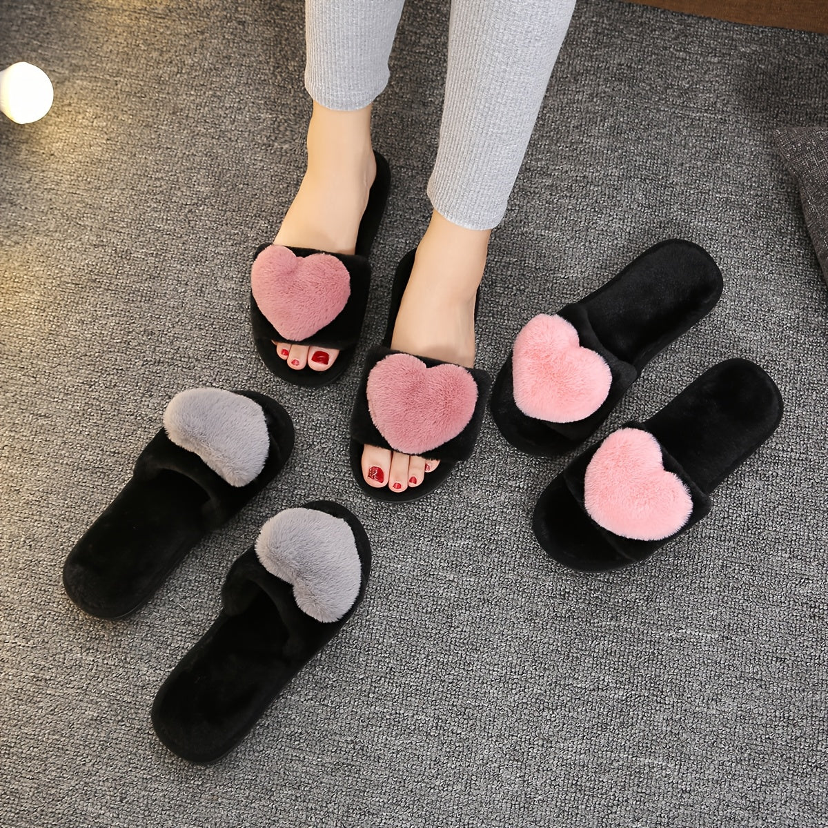 Warm and cozy women's plush slippers with heart accent for indoor comfort and style.