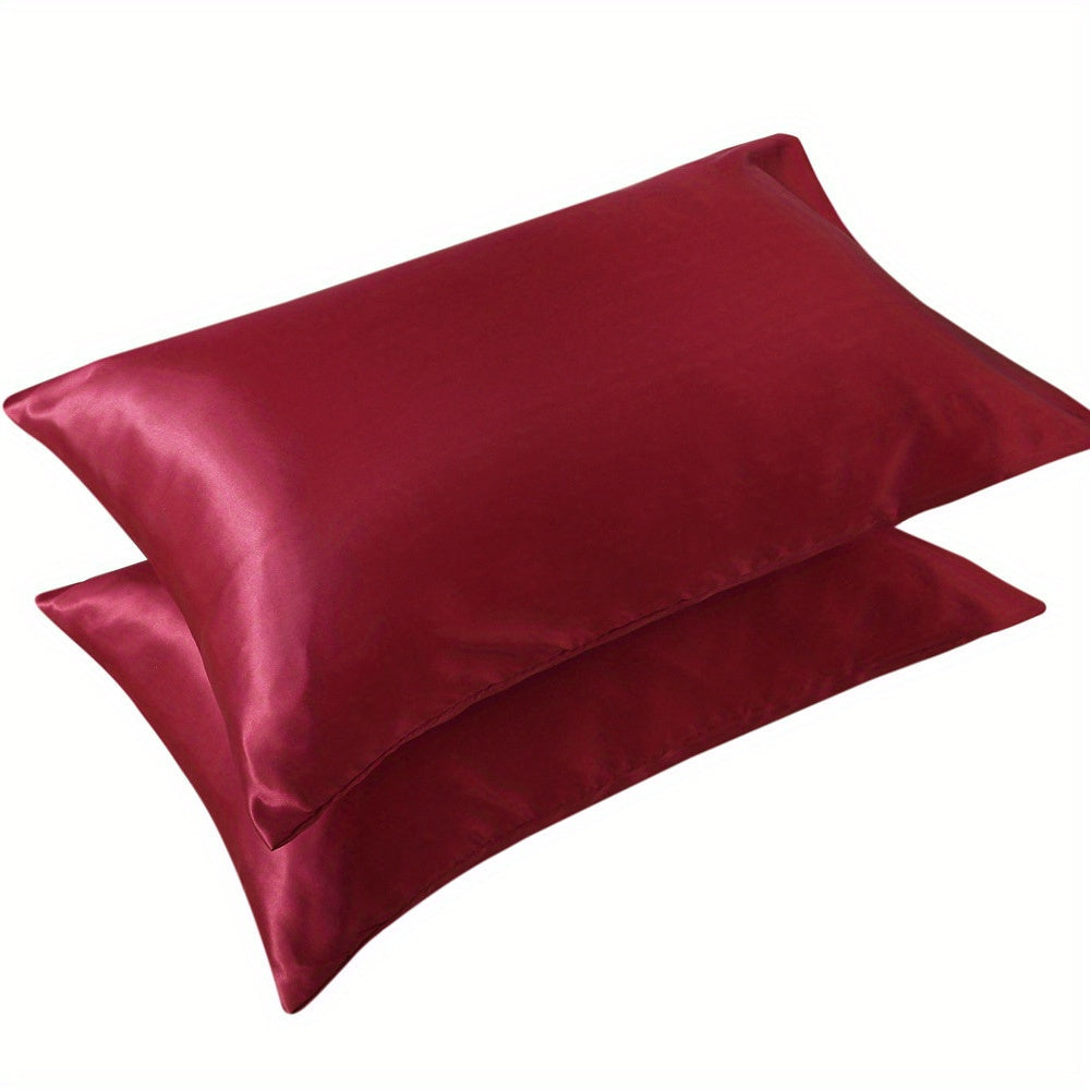 1 set of Satin Pillow Cases in a Solid Color, made with Silky Soft and Breathable material. These Pillowcases feature an Envelope Closure for a smooth and luxurious feel. Perfect for use in the Living Room, Bedroom, or Hotel, these Pillow Covers do not