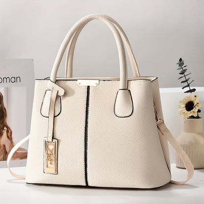 White synthetic leather tote bag with tag detail, versatile for dates, parties, and professionals. Large capacity with multi-layer design and strap closure.