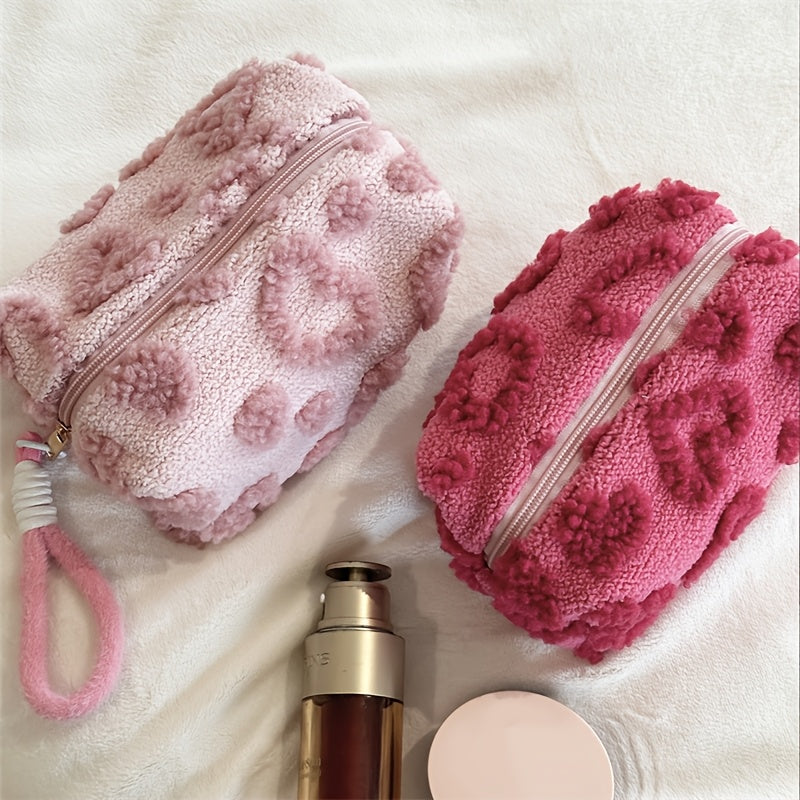 Heart-shaped hand carry bag for women, ideal for on-the-go skin care and cosmetic storage.