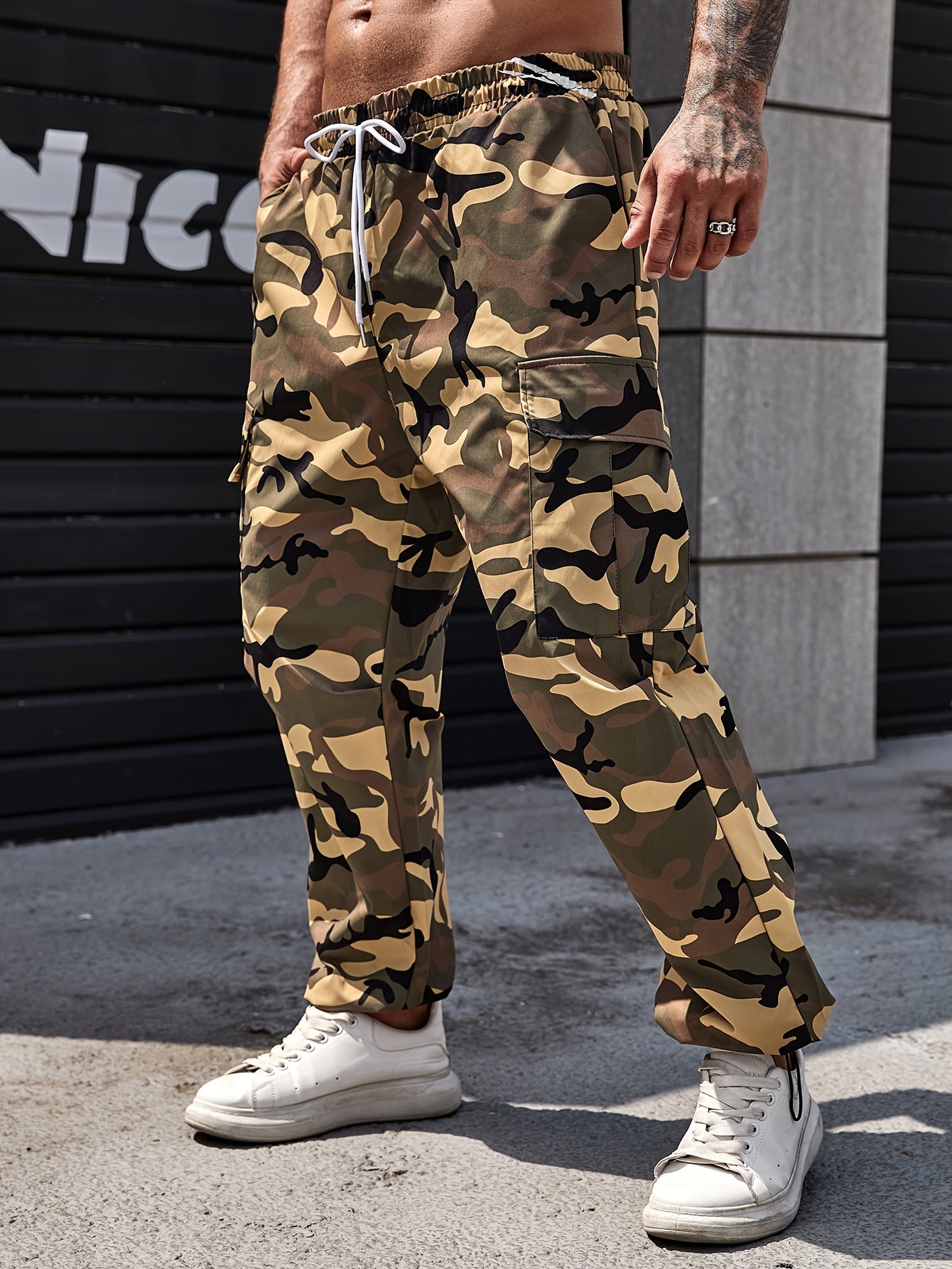 Men's plus size camo cargo pants, made of durable polyester with drawstring waist and multi-pocket design for outdoor activities.